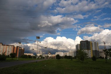 Dark rain clouds against the background of the Moscow sleeping area.