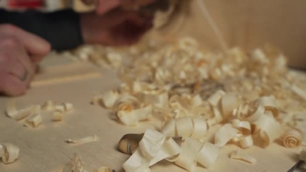 Handheld camera young joiner work with jointer in his workshop slow motion — Stock Video