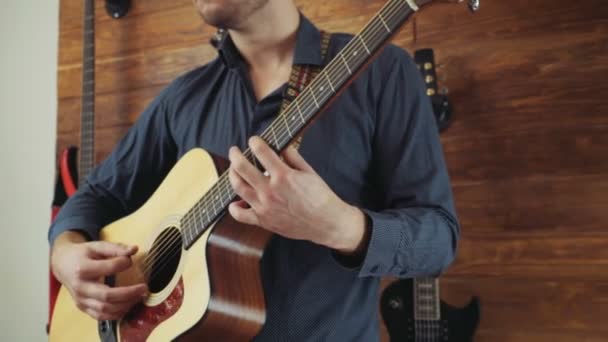 Close up man playing the acoustic guitar slow motion — Stock Video