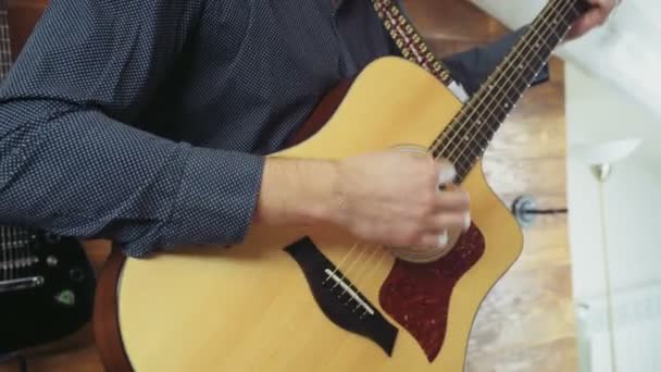 Close up man playing the acoustic guitar slow motion — Stock Video