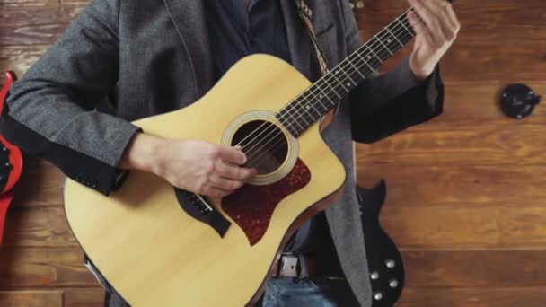 Close up man playing the acoustic guitar slow motion — Stock Video