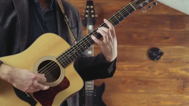 Close up man playing the acoustic guitar slow motion — Stock Video