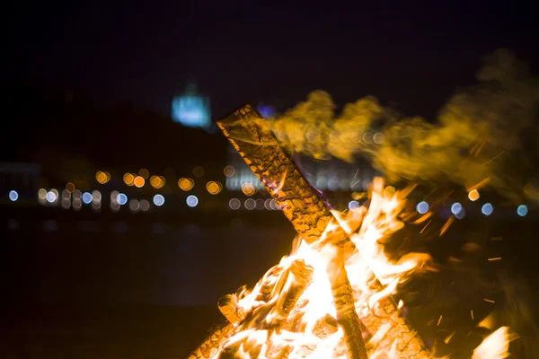 Bonfire on the background of the city lights — Stock Photo, Image