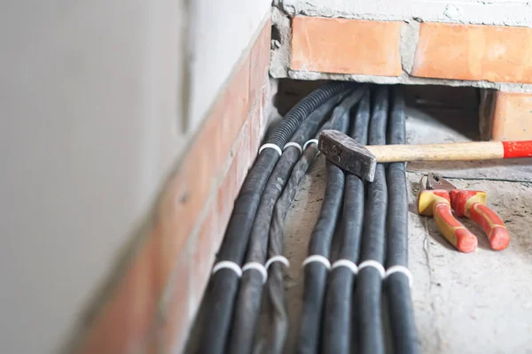 Installation of electrical wiring on the ceiling.Electrical cable system installation.