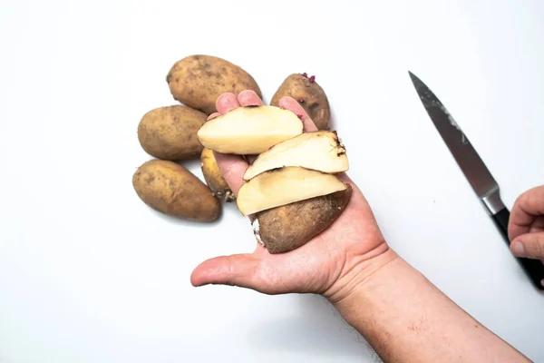 Guy Peels Potatoes White Background Next Lies Potatoes Peel — Stock Photo, Image