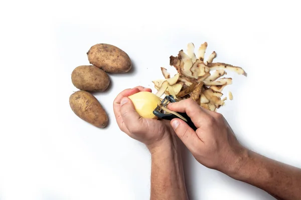 Guy Peels Potatoes White Background Next Lies Potatoes Peel — Stock Photo, Image