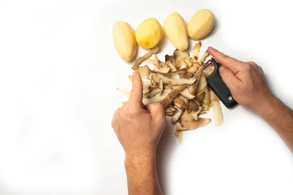 Guy Peels Potatoes White Background Next Lies Potatoes Peel — Stock Photo, Image