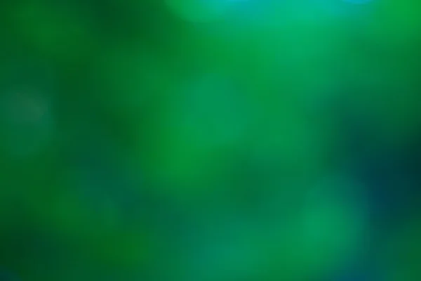 Abstrakt cirkulär grön bokeh bakgrund. — Stockfoto