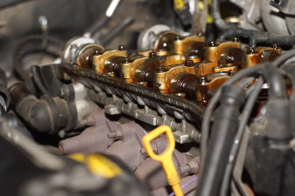 Mechanic hands tighten nut with wrench while repairing engine — Stock Photo, Image