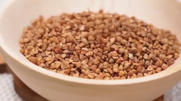 Buckwheat macro view on rustic background. gluten free ancient grain for healthy diet, selective focus — Stock Video