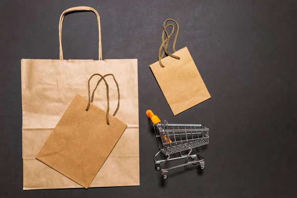 Brown paper bags with handles. Flat lay, top view, copy space, zero waste, plastic free items. Mockup eco package, online shopping concept