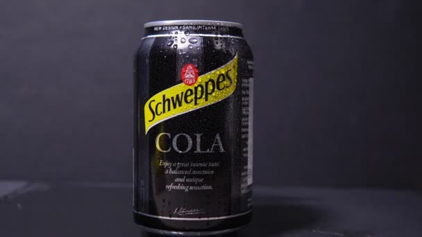 Tyumen, Russia-November 02, 2020: Can of the Schweppes cola logo close up. Water drops. — Stock Video