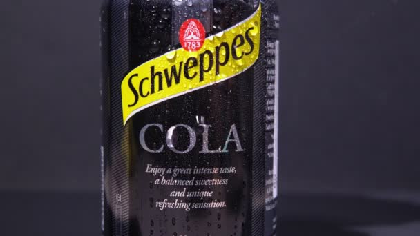 Tyumen, Russia-November 02, 2020: Can of soda drinks schweppes cola. Schweppes Mixers is a range of carbonated drinks manufactured by Coca-Cola. — Stock Video