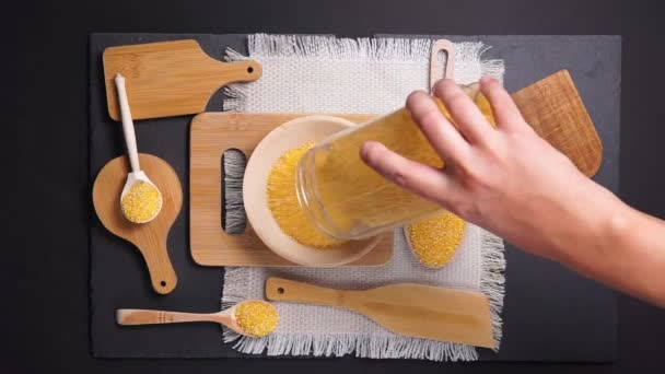 Grains of corn on wooden background. top view flat lay — Stock Video
