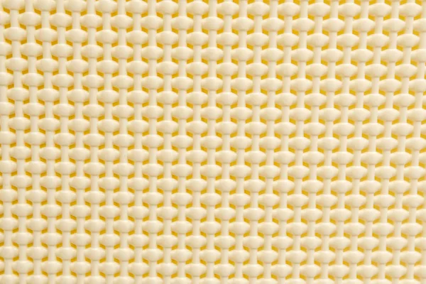 Gelber Plastikkorb Gitterhintergrund Abstraktion Stockbild