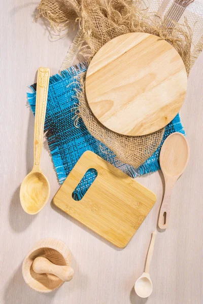 wooden Cutlery wooden spoon and chopping boards. the view from the top lay flat. vertical photo