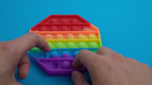 Toy pop it. Rainbow color. Antistress toy for children and adult. — Stock Video