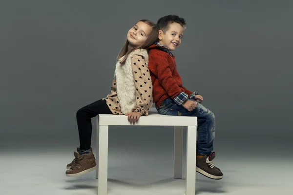 A portrait of a laughing girl and a smiling boy — Stock Photo, Image