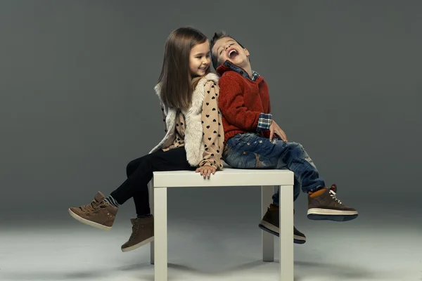 A portrait of a laughing girl and a smiling boy. Autumn style — Stock Photo, Image