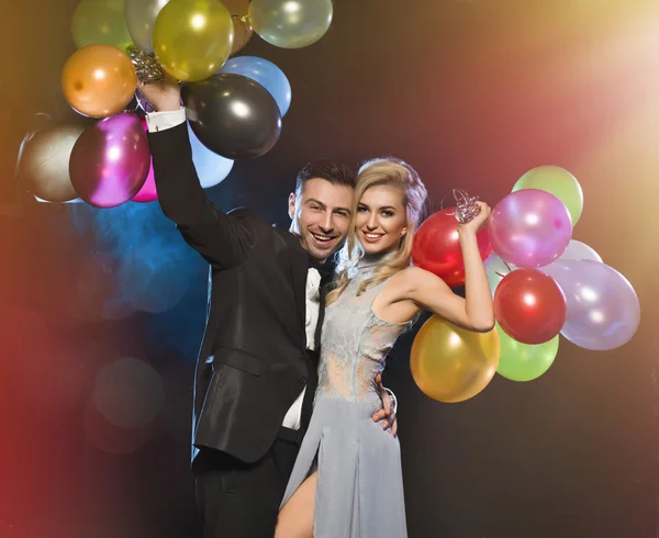 Smiling couple in love on the new years eve party — Stock Photo, Image