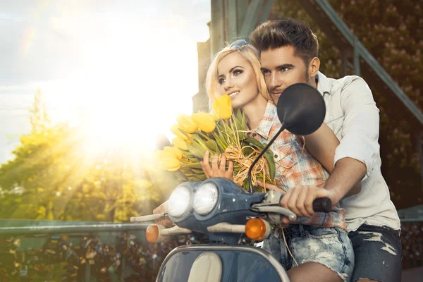 Happy free freedom couple driving scooter on summer date — Stock Photo, Image