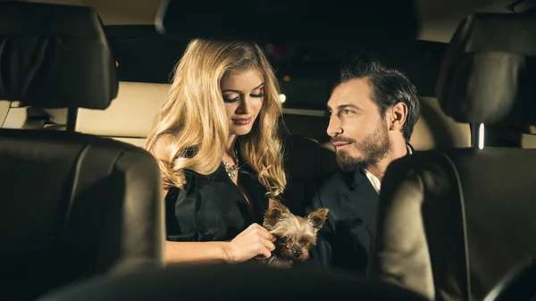 Sexy couple in the car. Focus on man — Stock Photo, Image