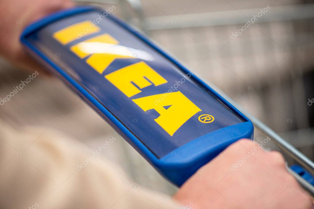 STOCKHOLM - NOV 12: Customer with trolley in IKEA shop in Stockholm, November 12. 2020 in Sweden. IKEA is a multinational group of Swedish companies that designs and sells ready-to-assemble furniture