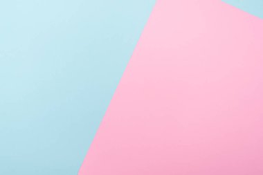 İki renkli kağıt mavi ve pembeyle kompozisyon, pastel ton, metin için boşluk bırak