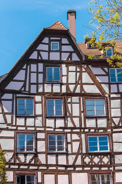 Natural half timbered old house in France, Strasbourg. Half timbered style. Facade of the historical wooden building during sunny spring day.
