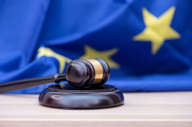  Flag of European Union and judges wooden gavel on the top, concept picture about court and justice clipart