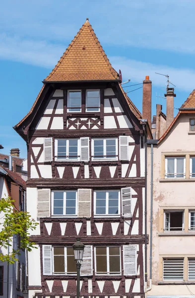 Half-timbered or half timbered old house in France, Strasbourg. Facade of the historical wooden building in France