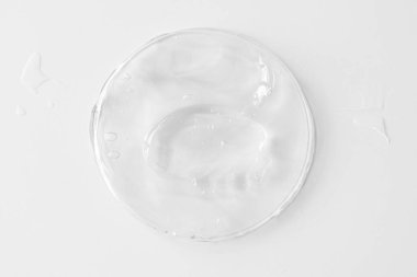 Vücudu şeffaf jel ya da krem kaplı plastik kutu, doku ya da arka plan olarak. Üst görünüm. 