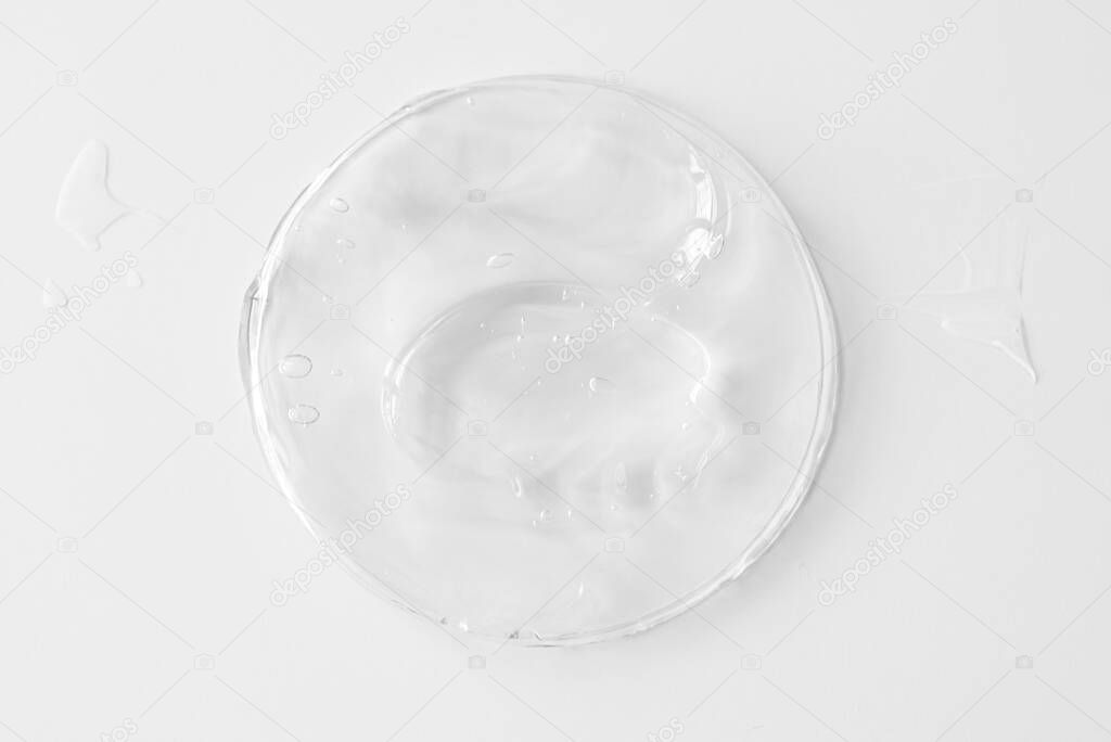 Plastic can with transparent gel or cream for body, as texture or background. Top view. 