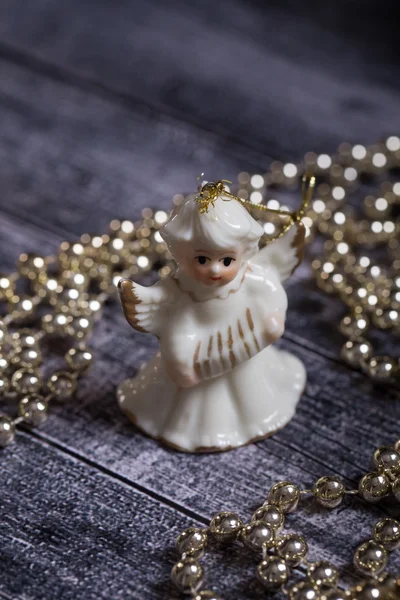 Ceramic angel standing on the wood table — Stock Photo, Image