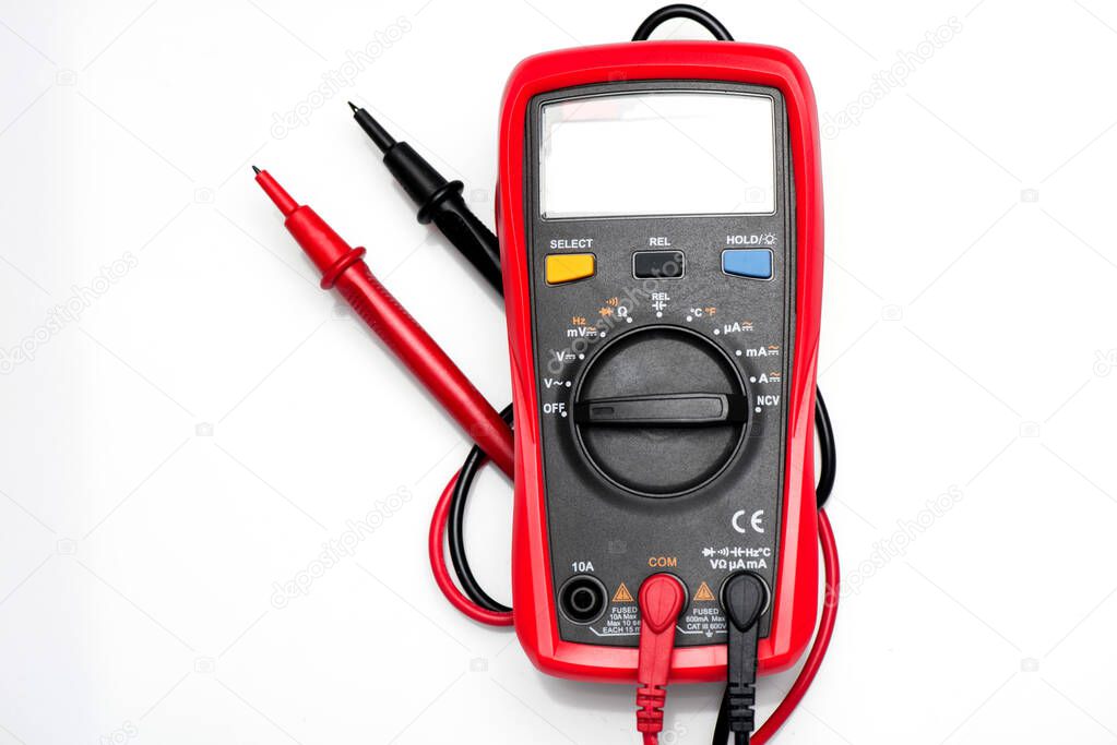 Electronic digital multimeter isolated on white with probes. Digital multimeter with red and black leads. Electronic multimeter isolated on white background close up