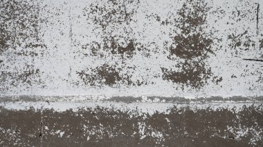 Çatlaklar ve çiziklerle dolu eski bir duvar. Tasarım posterleri, reklamlar ve daha fazlası için soyut grunge arkaplan dokusu.