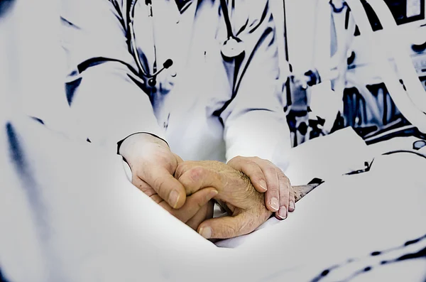 Nurse's compassionate hands Stock Picture