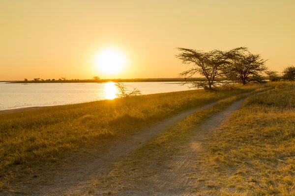 Zachód słońca Afryki Road — Zdjęcie stockowe