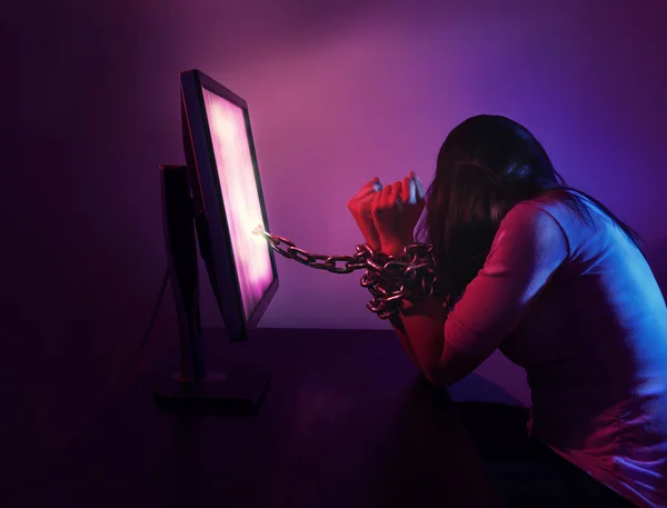 Woman chained to computer — Stock Photo, Image