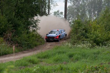 MIKOLAJKI, POLAND - JUL 1: Dani Sordo and his codriver Marc Marti in a Hyundai New Generation i20 WRC race in the 73nd Rally Poland, on July 1, 2016 in Mikolajki, Poland clipart