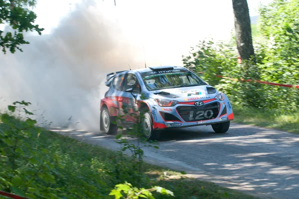 MIKOLAJKI, POLAND - JUL 4: Thierry Neuville and his codriver Nicolas Gilsoul in a Hyundai i20 WRC race in the 72nd Rally Poland, on July 4, 2015 in Mikolajki, Poland. — Stock Photo, Image