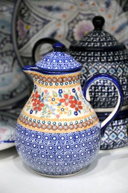 Old style handmade ceramics from Uzbekistan painted with traditional national ornaments in one of shops in Izmailovo craft market Verinissage. MOSCOW, RUSSIA.