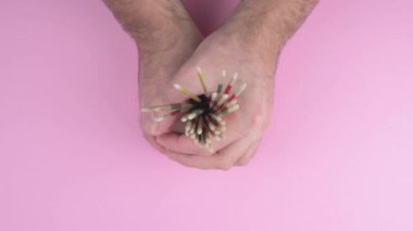 releasing a bundle of wooden mikado sticks