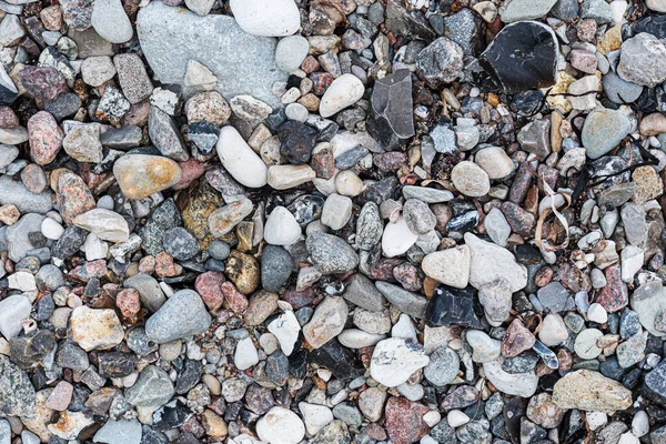 Bovenaanzicht van kiezels of stenen op het strand — Stockfoto