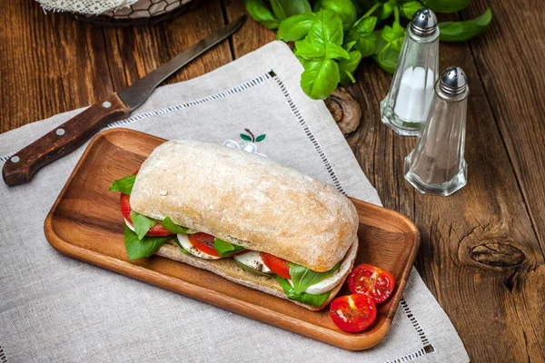 Ciabata with mozzarella, tomato and basil — Stock Photo, Image