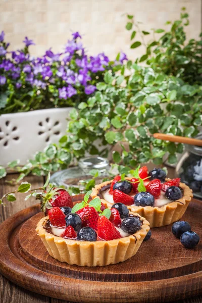 stock image Fresh homemade fruit tart with strawberries and blueberries.