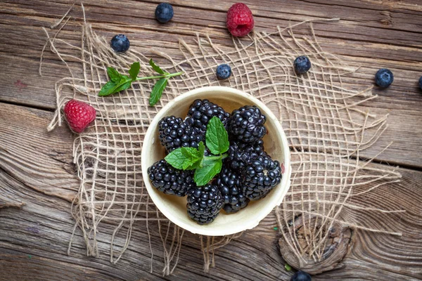 Blackberries in a waffle bowls. — Stock Photo, Image