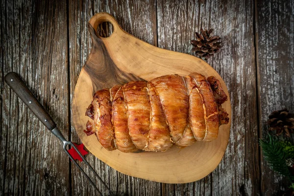 Baked Rolled Bacon Wooden Chopping Board Top View — Stock Photo, Image