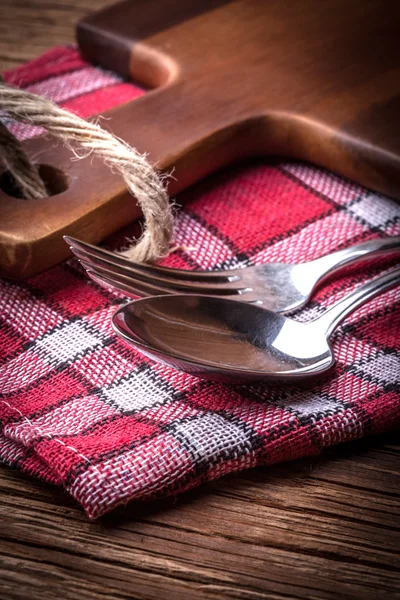 Old fork and spoon on old wooden boards. — Stock Photo, Image