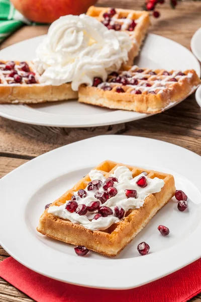 Waffles with pomegranate. Stock Picture